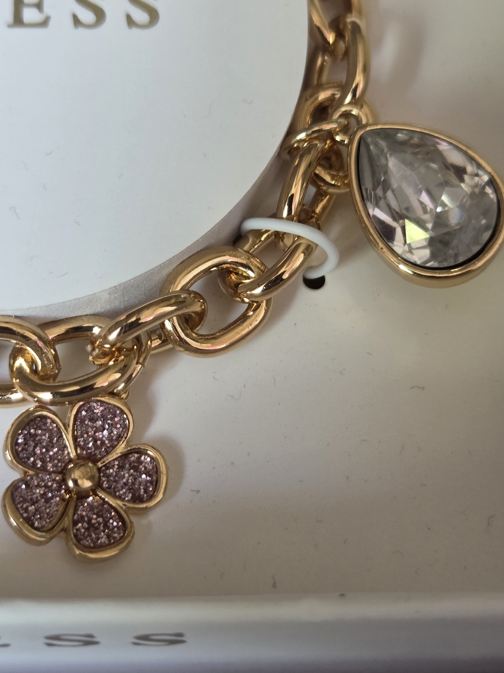 GUESS Gold-Tone Pink Charm Bracelet - Picture 5 of 7